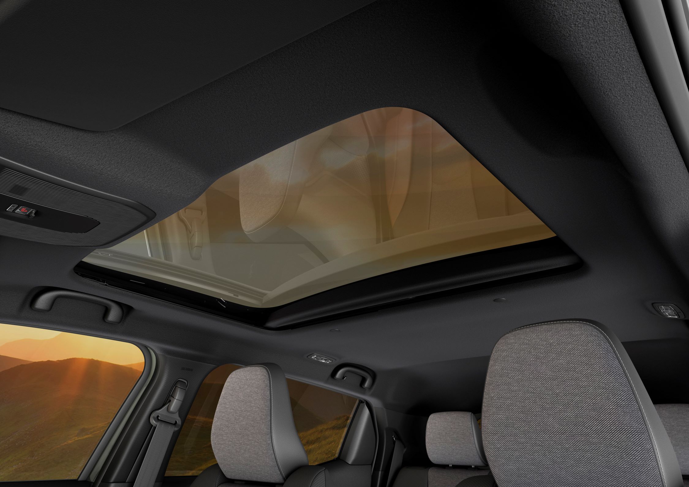 Car interior with panoramic sunroof and grey seats.