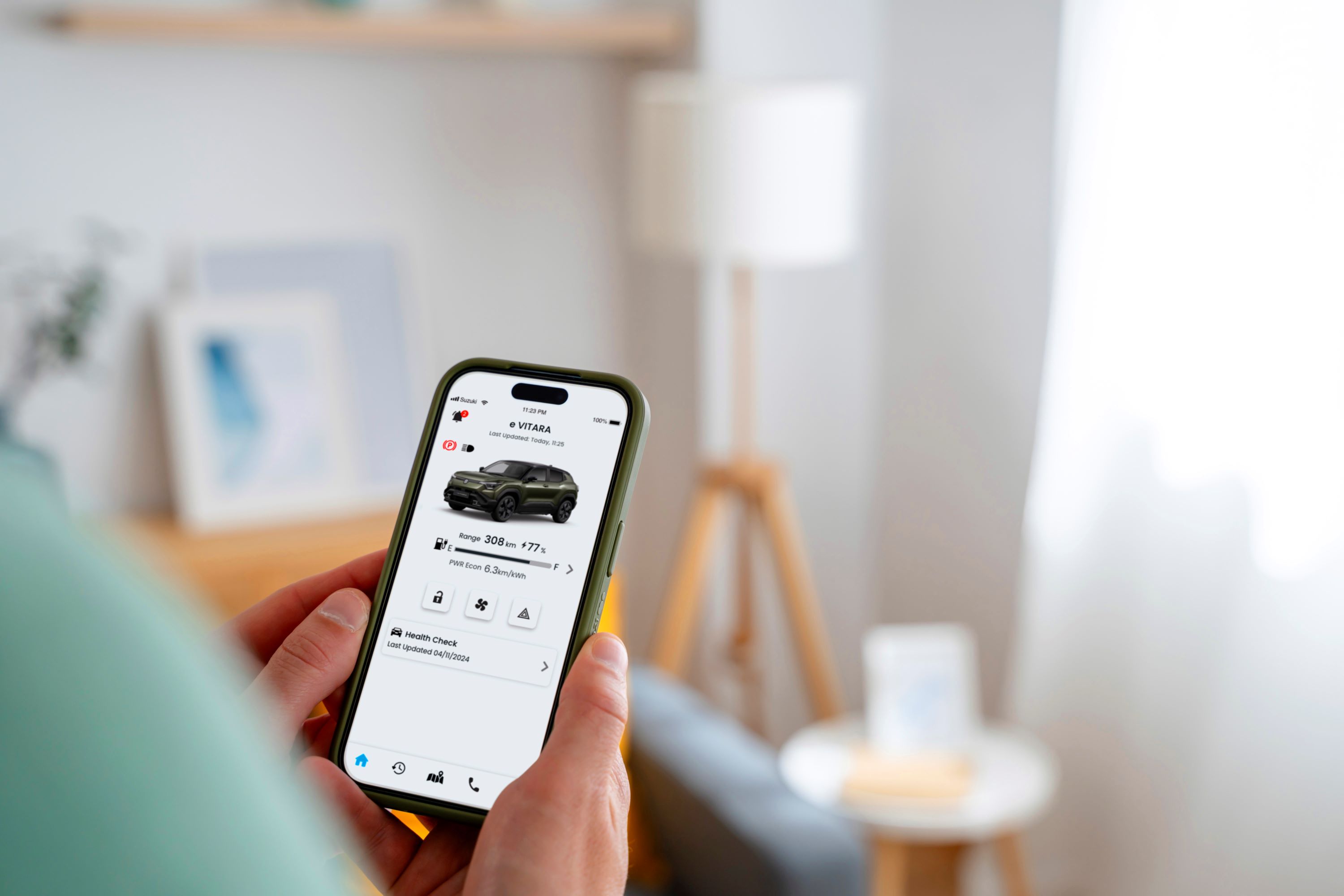 Person using a smartphone to check car status on an app.